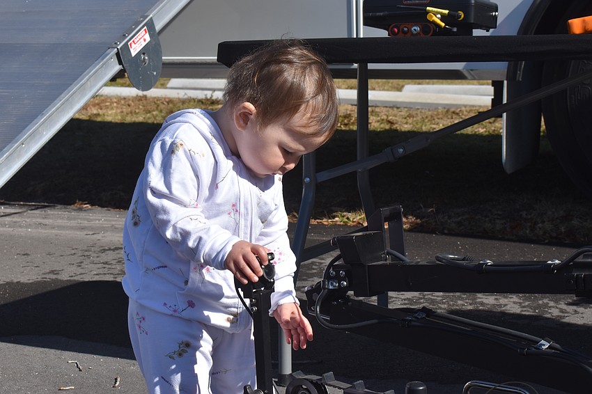Greenbrooks 16-month-old Lina Osterman checks out the bomb squad robot at the Celebrate Our First Responders event put on by Lakewood Ranch Community Emergency Response Team.