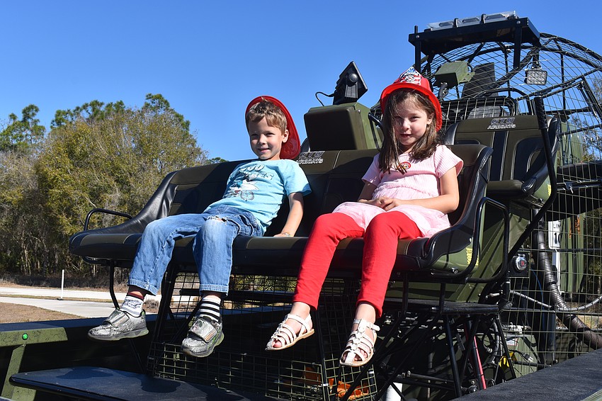 Greenbrook's Kevin Scerry and Katrina Scerry, 5-year-old twins, take advantage of the opportunity to sit on the GTO Performance airboat.