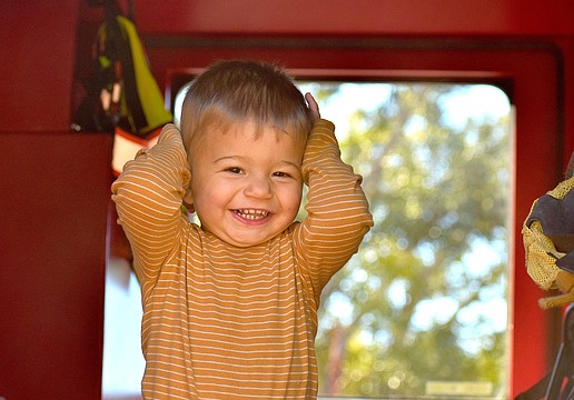 Lakehouse Cove's 16-month-old Hunter Colon shows his excitement to be inside a fire truck at the Celebrate Our First Responders event Feb. 7 at the Greenbrook Adventure Park.