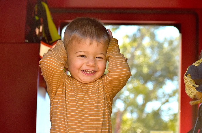 Lakehouse Cove's 16-month-old Hunter Colon shows his excitement to be inside a fire truck at the Celebrate Our First Responders event Feb. 7 at the Greenbrook Adventure Park.