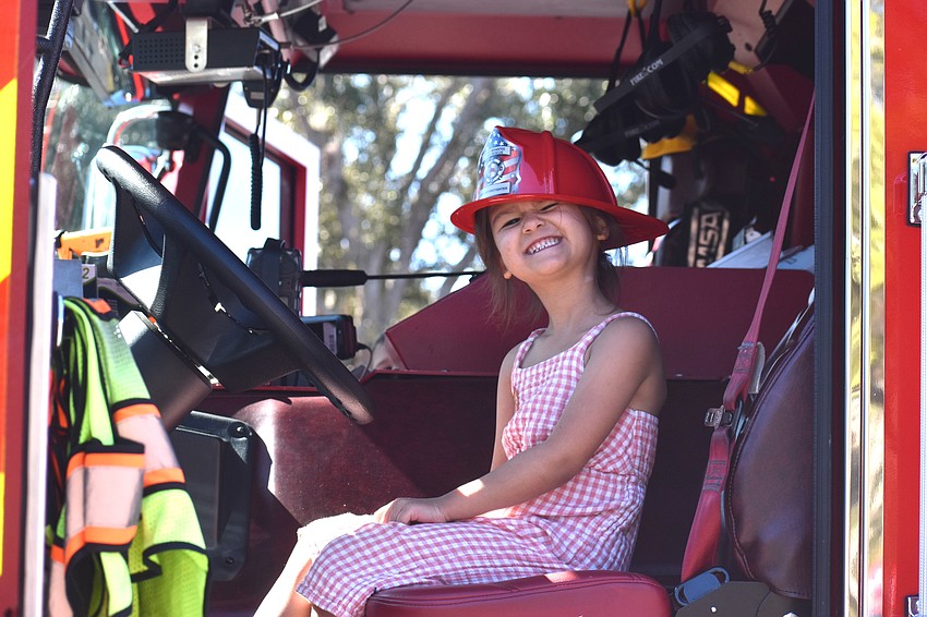 Greenbrook's Payton Merritt, 5, gives a big smile while sitting in an East County Fire Rescue firetruck at the Celebrate Our First Responders event on Feb. 7.