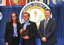 The School District of Manatee County's Superintendent Laurie Breslin, Educator of the Year Clifford Dawson and Deputy Superintendent of Instructional Services Derek Jensen pose for a photo at the Excellence in Education Awards on Feb. 4.