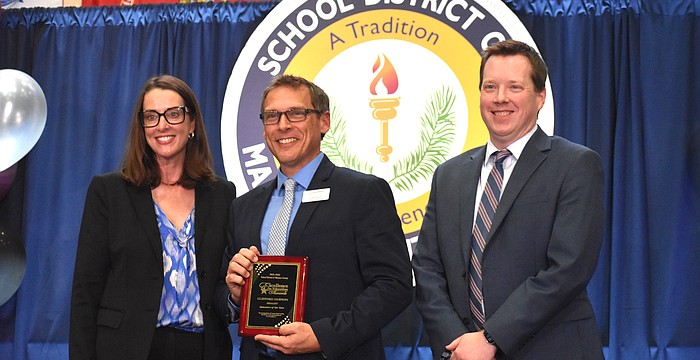 The School District of Manatee County's Superintendent Laurie Breslin, Educator of the Year Clifford Dawson and Deputy Superintendent of Instructional Services Derek Jensen pose for a photo at the Excellence in Education Awards on Feb. 4.