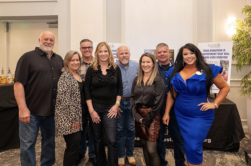 Suncoast Charities Board Members Mark Hayward, Terri Antonelli, Greg and Wendy Linehan, John Desrosiers, Shawna Frank, Keith Martin and Johna Derosiers