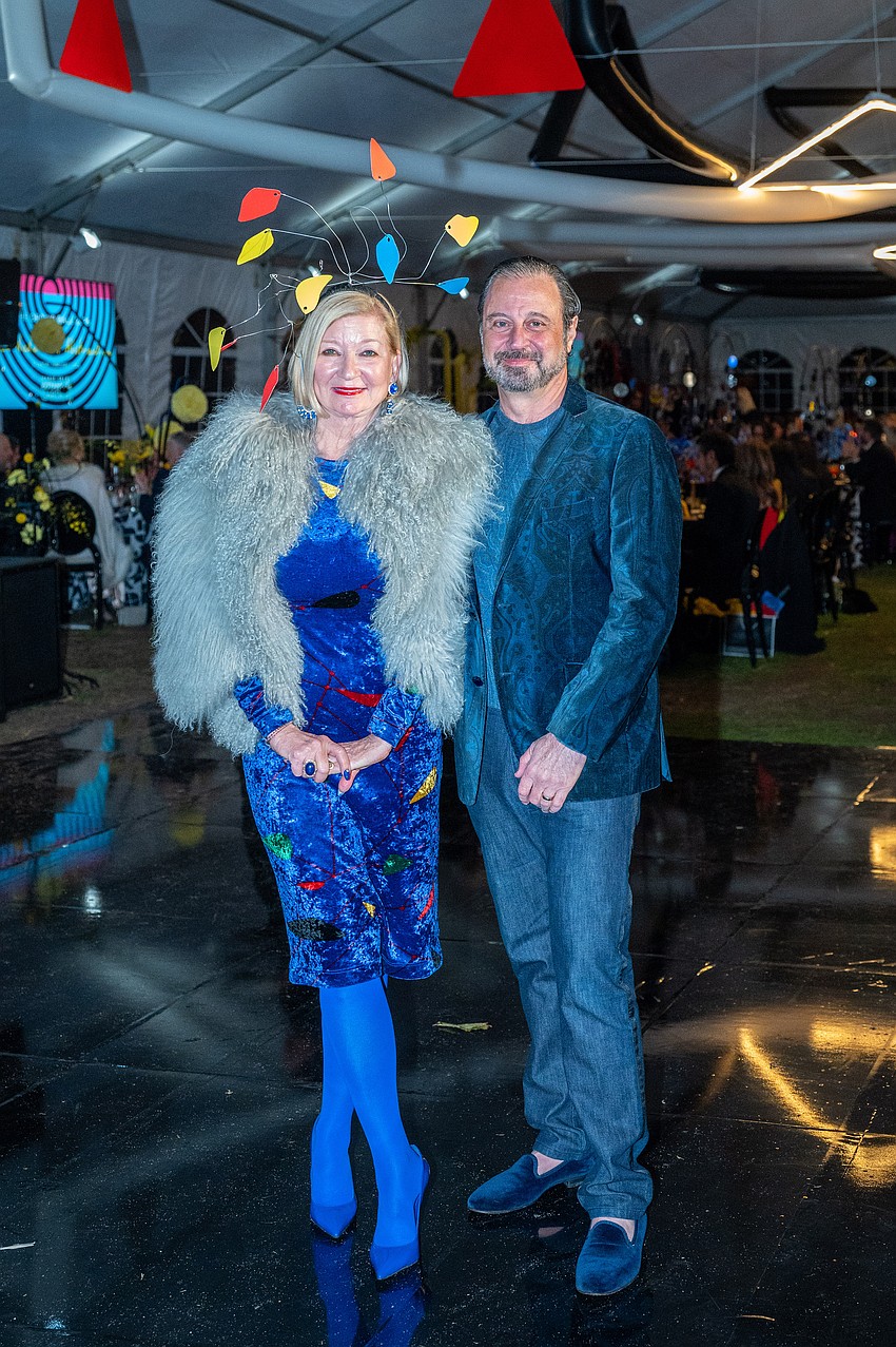 Debra Blue wears an Orchid Ball matching headpiece and George Adley wears his blue velvet.