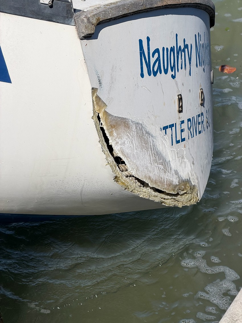 Naughty Nights has a damaged hull and is resting against a damaged dock bordering Sarasota Bay. Boats without navigation, hull integrity or proper propulsion can be declared derelict and are subject to removal at the registered owner’s expense if not made seaworthy after notified by police.