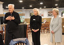 Frank Martucci, joined by Kiwanis Club of Longboat Key President Danielle Gladding and his wife, Katherine Martucci, explains what compelled him to give back his 50/50 raffle winnings from the Lawn Party to support the Children's Guardian Fund.