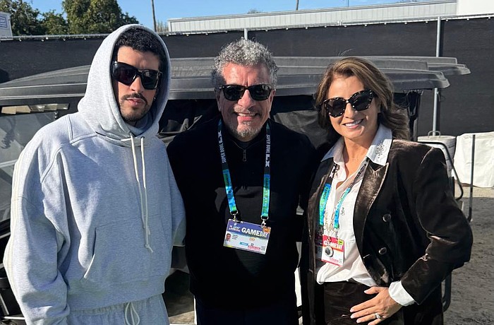 Puerto Rican singer and rapper Bad Bunny poses with Sarasota Orchestra maestro Giancarlo Guerrero and Guerrero's wife, Shirley, before Super Bowl LX on Feb. 8 in Santa Clara, California.
