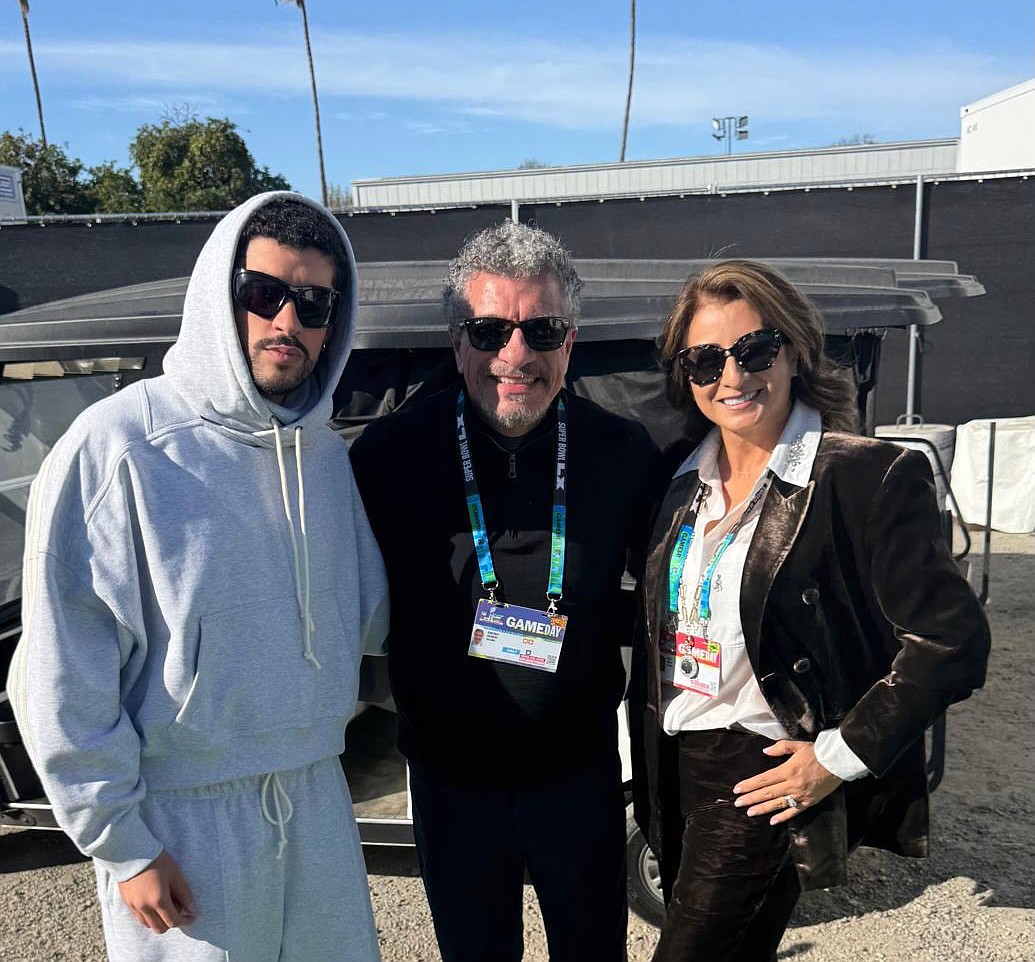 Puerto Rican singer and rapper Bad Bunny poses with Sarasota Orchestra maestro Giancarlo Guerrero and Guerrero's wife, Shirley, before Super Bowl LX on Feb. 8 in Santa Clara, California.