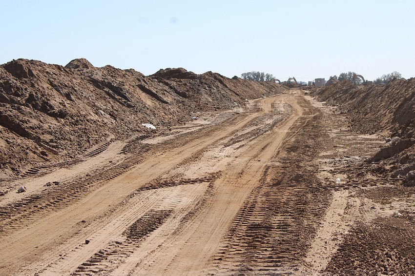 Although the area looks desolate, the base for a four-lane extension of Bourneside Boulevard is in place and ready for the final stages of construction.