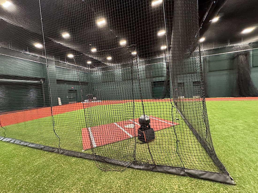 Four batting gates inside the new Baltimore Orioles player development complex total nearly 16,000 square feet and feature turf used in Major League Baseball stadiums. The nets can be lifted to convert the space into a full field.