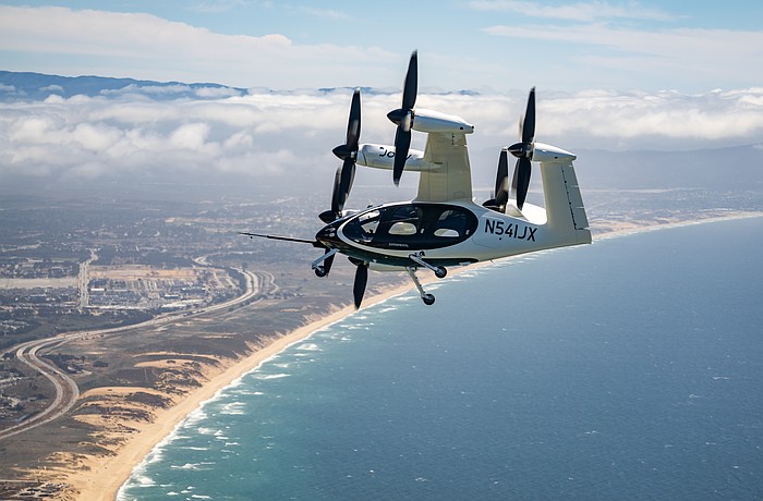 An eVTOL manufactured by Joby Aviation flies over Monterey Bay in California.