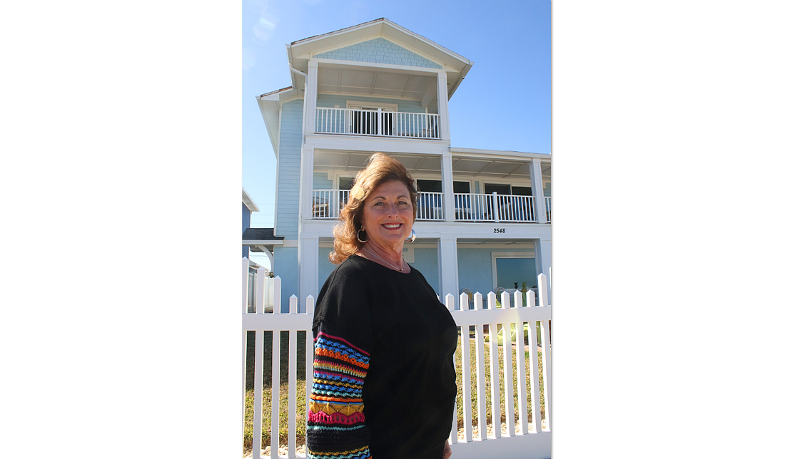 Local Realtor Deborah Ronson stands in front of three Flagler Beach properties featured in HGTV’s House Hunters: Amazing Water Homes, now streaming.
Photo by Christine Rodenbaugh