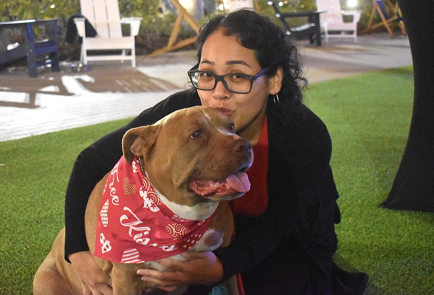 Lakewood Ranch's Chan Suy says Zoey, her 10-year-old pitbull, carries a variety of items around including mail, shopping bags and even carry-out.