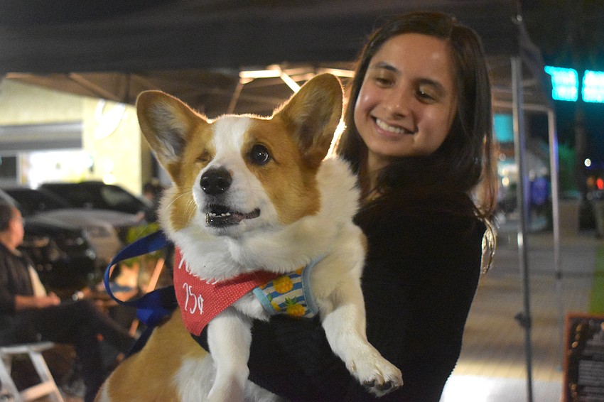 Sarasota's Marty, a 10-year-old Corgi, gets a lift from Addie Osmar. Despite only having one eye, Marty still loves going out and spreading love.