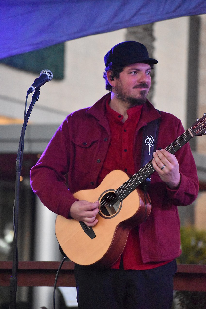 Pedro Rizzardi, a guitar player in the band Sugar Vibe, enjoys playing events at University Town Center because he can always tell the audience is enjoying the music.