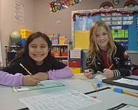 Aurora Pena and Theo Light, second graders at Tara Elementary School, appreciate the new and improved classrooms and cafeteria.They are also looking forward to using the new field and playground when they are complete.