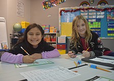 Aurora Pena and Theo Light, second graders at Tara Elementary School, appreciate the new and improved classrooms and cafeteria.They are also looking forward to using the new field and playground when they are complete.