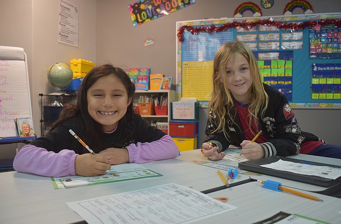 Aurora Pena and Theo Light, second graders at Tara Elementary School, appreciate the new and improved classrooms and cafeteria.They are also looking forward to using the new field and playground when they are complete.