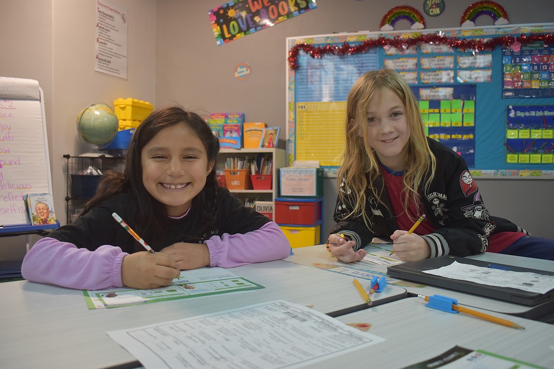 Aurora Pena and Theo Light, second graders at Tara Elementary School, appreciate the new and improved classrooms and cafeteria.They are also looking forward to using the new field and playground when they are complete.