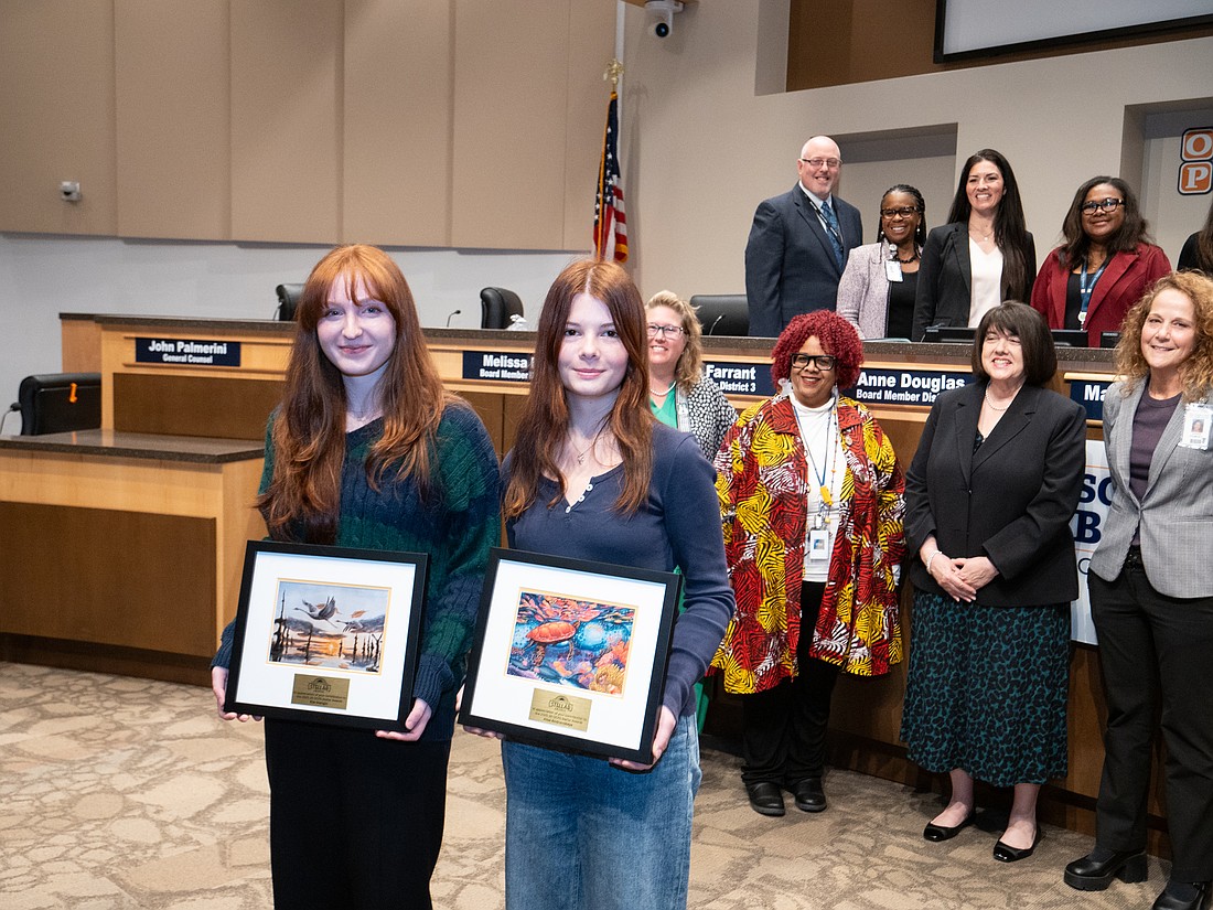 Dr. Phillips High School's Alisa Andrievskaya and Elle Mangin for their outstanding artistic achievements during the Orange County School Board's meeting Tuesday, Feb. 10.