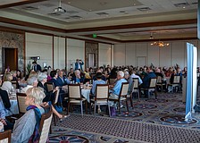 Longboat Key Democratic Club President Lucie Lapovsky (right) updates the 160 attendees on new initiatives the Club is starting soon at a luncheon Tuesday, Feb. 10.