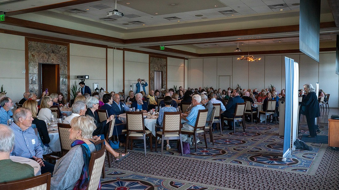Longboat Key Democratic Club President Lucie Lapovsky (right) updates the 160 attendees on new initiatives the Club is starting soon at a luncheon Tuesday, Feb. 10.