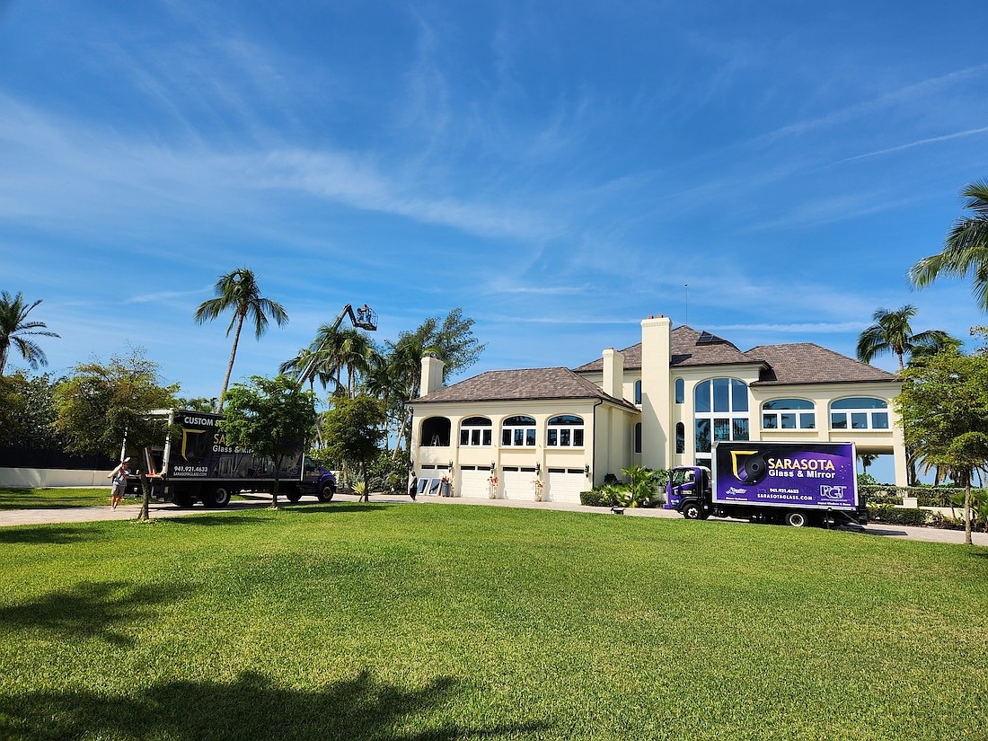 Sarasota Glass & Mirror has a fleet of purple trucks bearing its name.