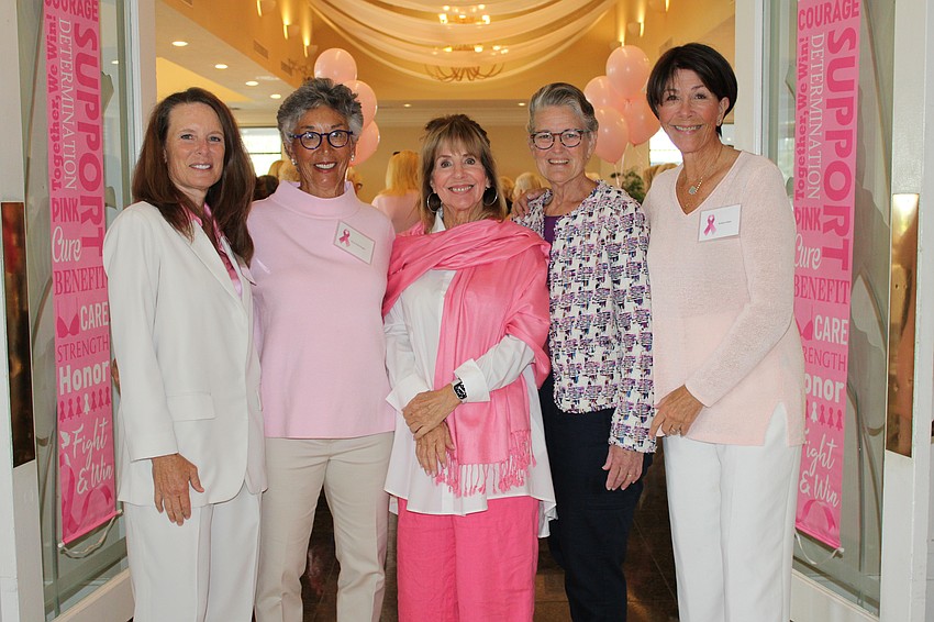 Go for the Cure co-chairs Tracy Cormier, Amy Renninger and Judy Brostron welcome guests Suellen Kaeb and Arleen Klein to the games day fundraiser on Feb. 11.