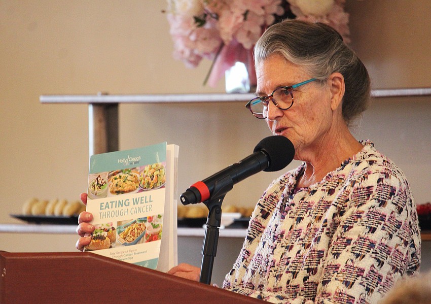 Suellen Kaeb, chair of Breast Health Sarasota Inc., thanks attendees at the Go for the Cure games day for supporting the organization's mission to support community members with access to health services.