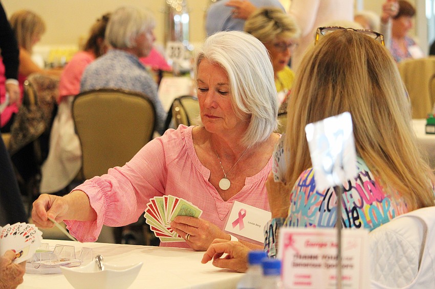 Louise Berg plays a hand at the Go for the Cure games day.