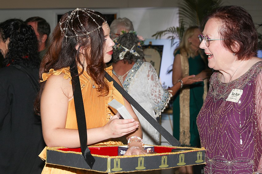 It appears that Sue Rupp, right, received a favorable Tarot card reading from Valerie Rozon.