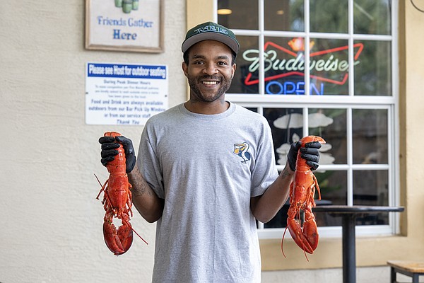 General manager Desmond Hill brings warmth and ease to Lucky Pelican’s welcoming, neighborhood vibe.