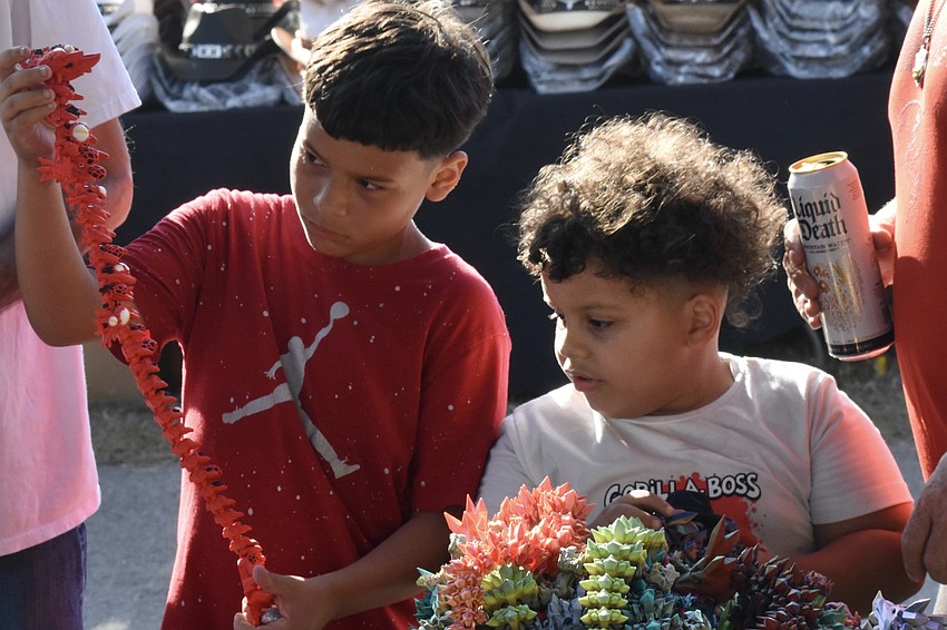 Jordan Pence, 10, and Sutton Pence, 6, explore some of the toys on offer.