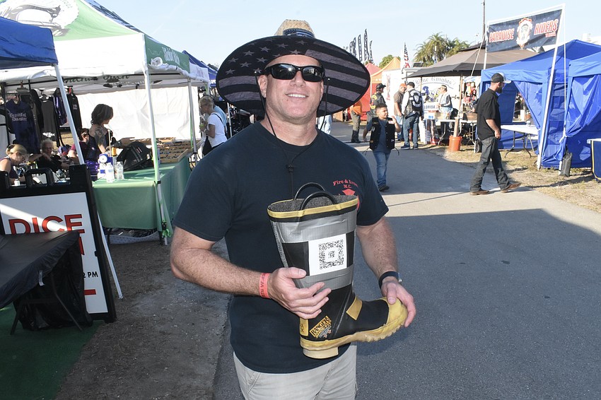 Firefighter Mark Maiure collects donations.