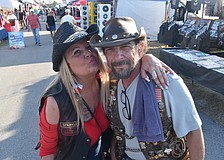 Christine Cassanelli stands with her friend Miles Christian-Hart, founder of Paradise Riders.