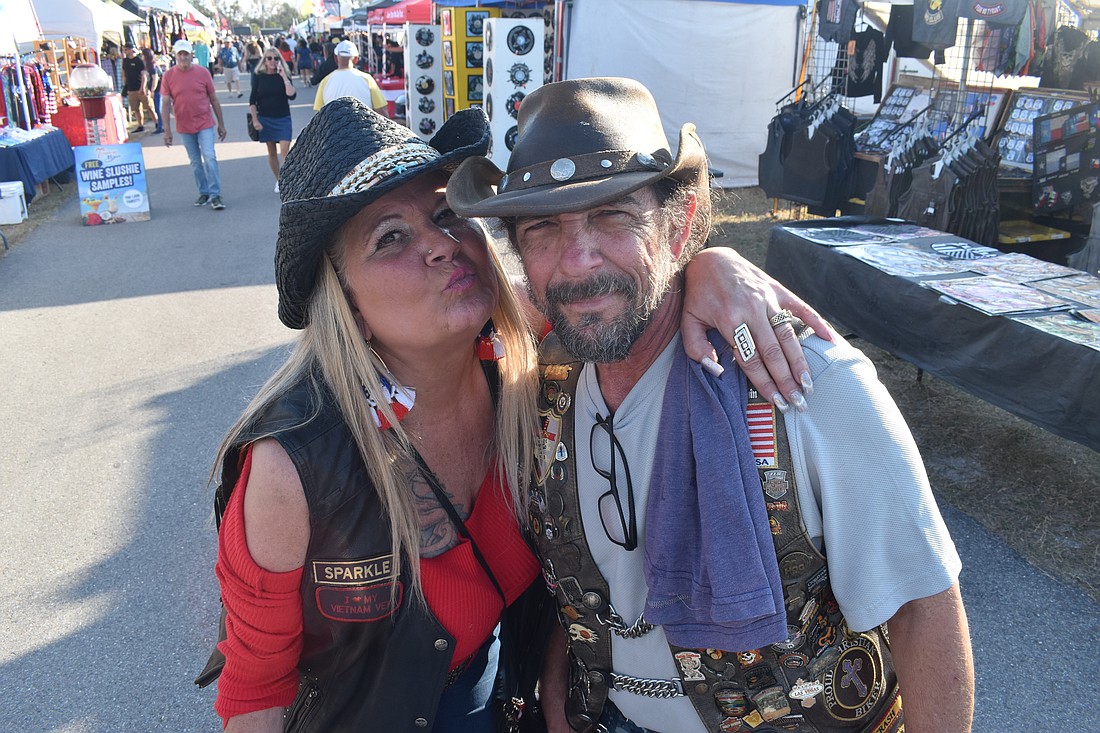 Christine Cassanelli stands with her friend Miles Christian-Hart, founder of Paradise Riders.