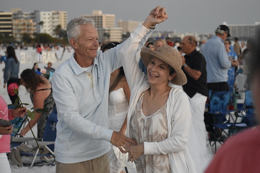 Patrick and Beverly Lyons dance on the beach.