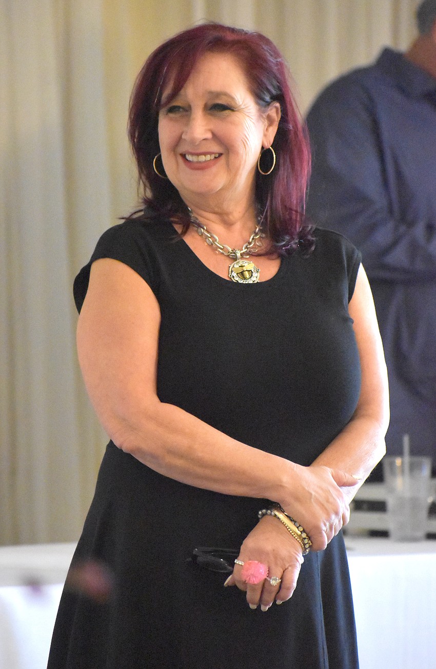 Darci Jacob, owner of Darci's boutique, provided the outfits the models wore from her store and described each outfit and model as they showed what they were wearing. Everything they modeled was for sale.