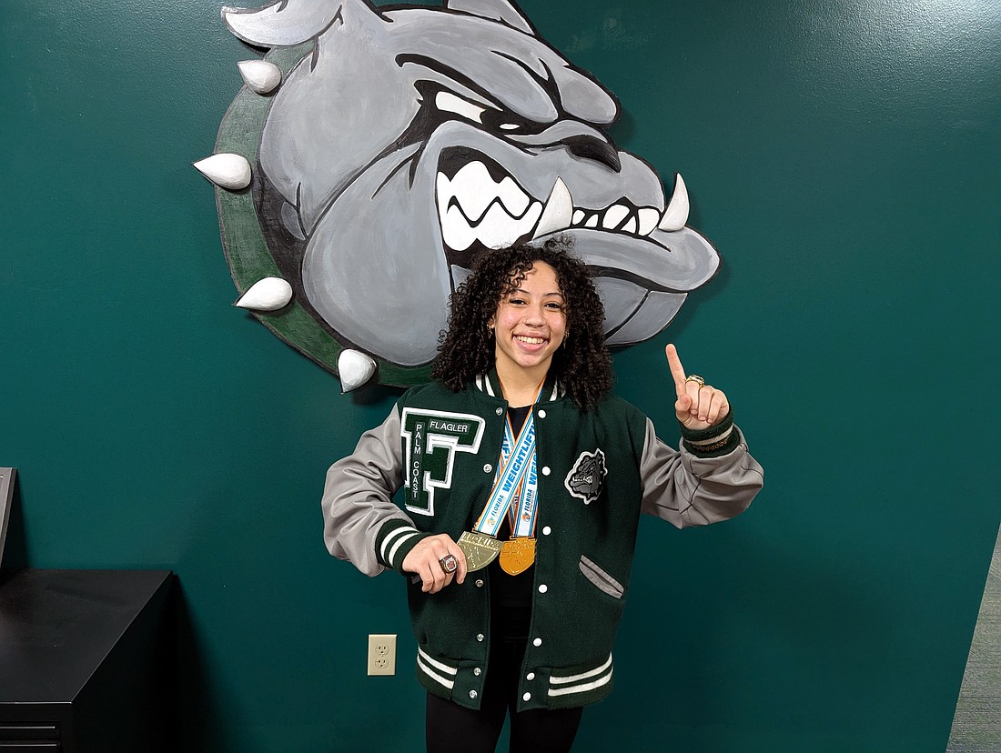 Flagler Palm Coast junior Nya Williams won two state weightlifting championships and set a state record in the 119-pound weight class. Her total lifts with her body weight made her the top lifter at the meet.Photo by Brent Woronoff