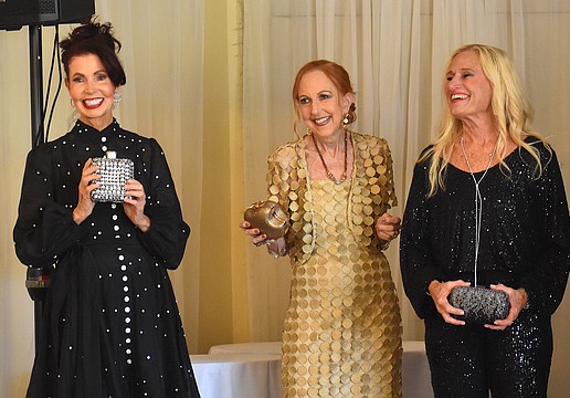 The Passion for Fashion show, the Palm Aire Women's Club's biggest fundraiser of the year, took place Feb. 13 at the Palm Aire Country Club. Katherine Pike, Susan Romine and Kay Kwenski's last looks from Darci's boutique are cocktail attire.
