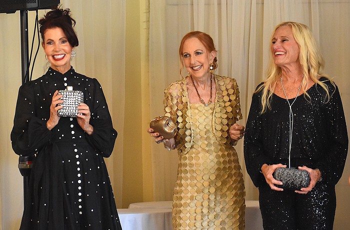 The Passion for Fashion show, the Palm Aire Women's Club's biggest fundraiser of the year, took place Feb. 13 at the Palm Aire Country Club. Katherine Pike, Susan Romine and Kay Kwenski's last looks from Darci's boutique are cocktail attire.
