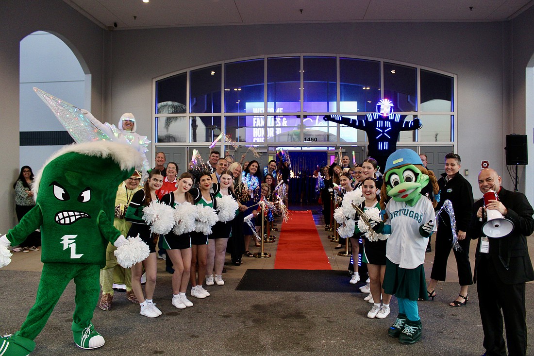 Volunteers line the red carpet, cheering and applauding guests as they make their grand entrance. Photo by Alexis Miller