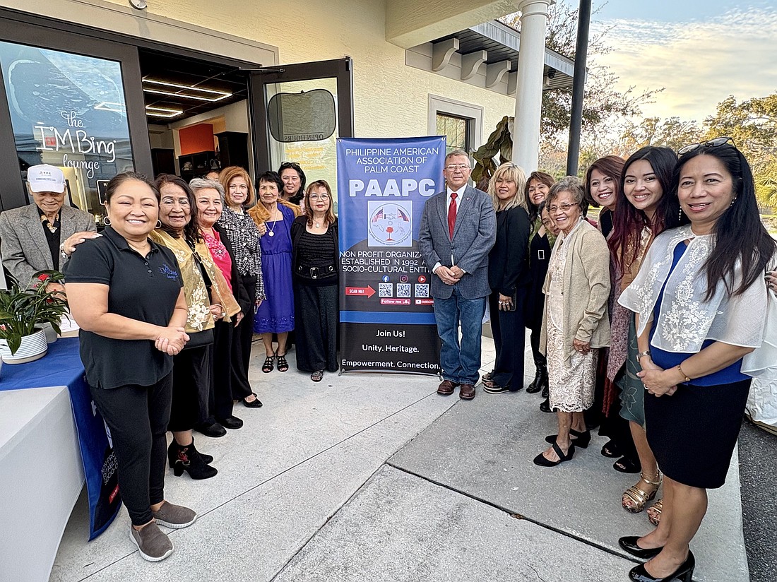 Palm Coast Mayor Mike Norris (center) participated in the Philippine American Association of Palm Coast's officer induction ceremony at the IMBing Lounge. Courtesy photo