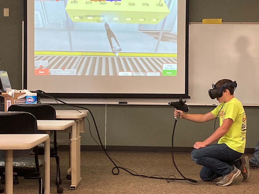 Campers practice coating using virtual reality.