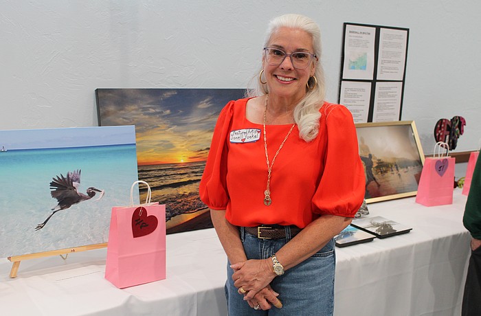 Artist Jonell Yoekel showcases her nature photography at the Women's Guild Valentine's Day-themed art show on Feb. 10 at St. Mary, Star of the Sea, Catholic Church.