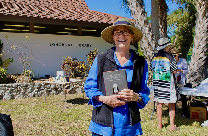 Nancy Prendergast walks away from the annual Longboat Library book sale happy with her find of a book by Jenny Lawson.