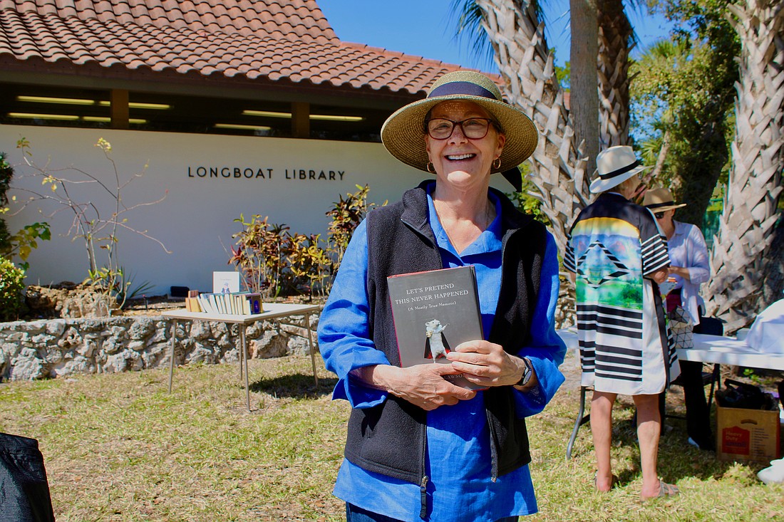 Nancy Prendergast walks away from the annual Longboat Library book sale happy with her find of a book by Jenny Lawson.