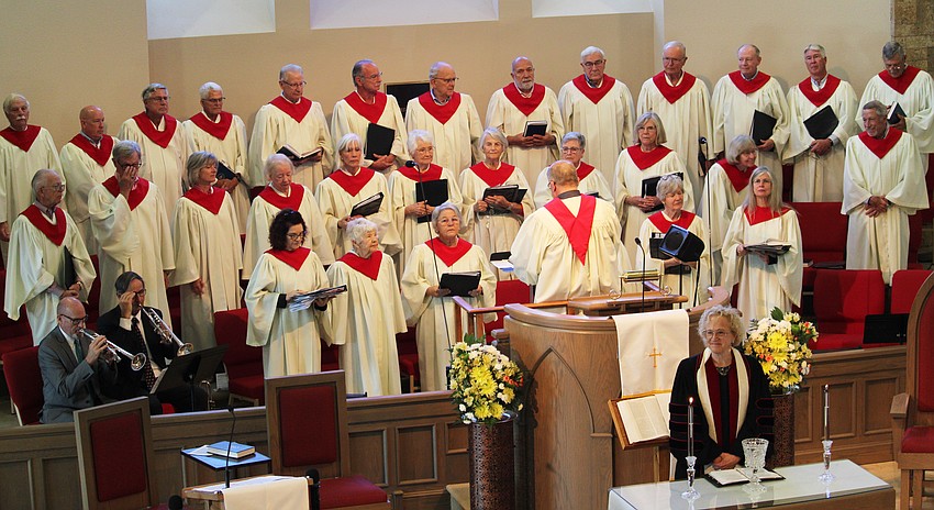 In addition to leading the 100 community members who joined in singing 