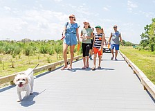 Bob Gardner Park offers a mile of trails, sports courts, frisbee golf, pavilions, a kids’ gravity rail and dog parks, all set against peaceful wetland preserves.
